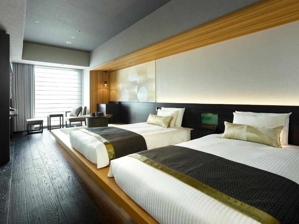 Postel nebo postele na pokoji v ubytování Mitsui Garden Hotel Ginza-gochome
