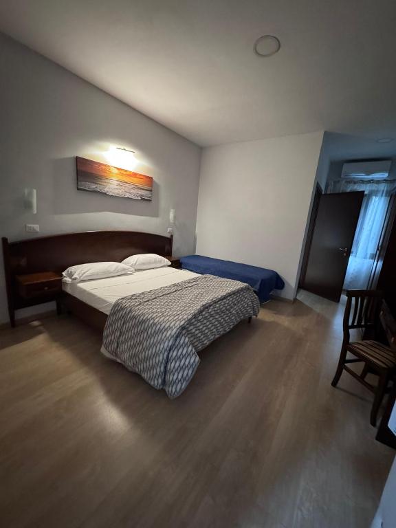 Postel nebo postele na pokoji v ubytování Hotel Le Pinede Relax