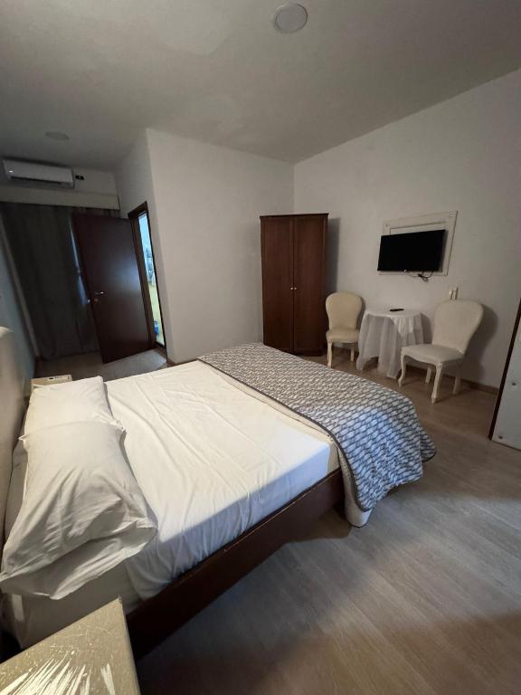 Postel nebo postele na pokoji v ubytování Hotel Le Pinede Relax