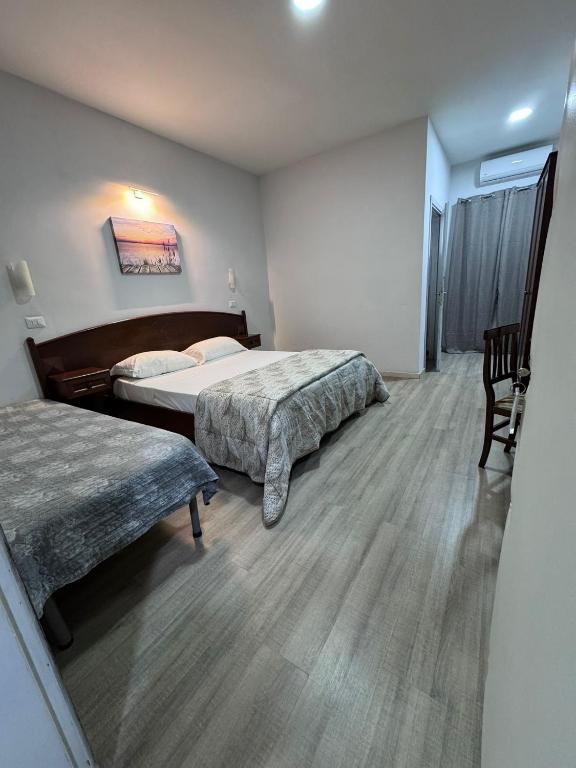 Postel nebo postele na pokoji v ubytování Hotel Le Pinede Relax