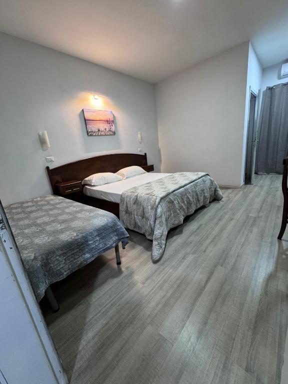 Postel nebo postele na pokoji v ubytování Hotel Le Pinede Relax