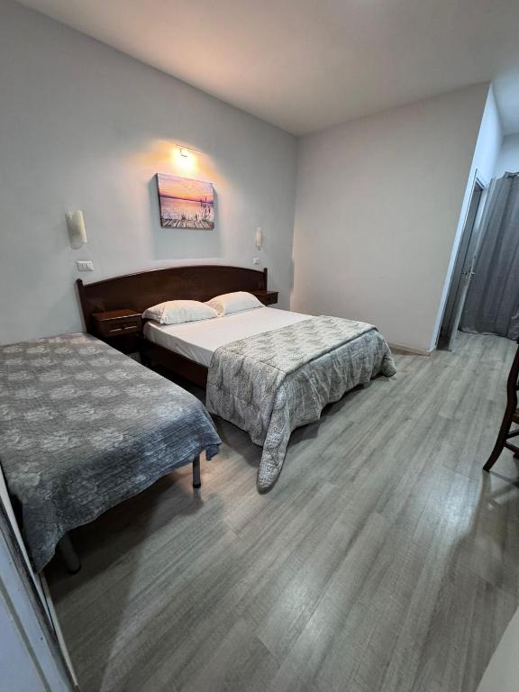 Postel nebo postele na pokoji v ubytování Hotel Le Pinede Relax