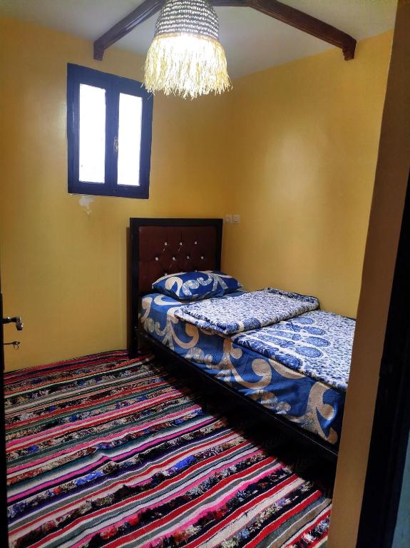 Postel nebo postele na pokoji v ubytování Gîte Assonfo Tachdirt