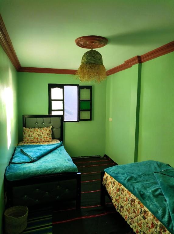 Postel nebo postele na pokoji v ubytování Gîte Assonfo Tachdirt