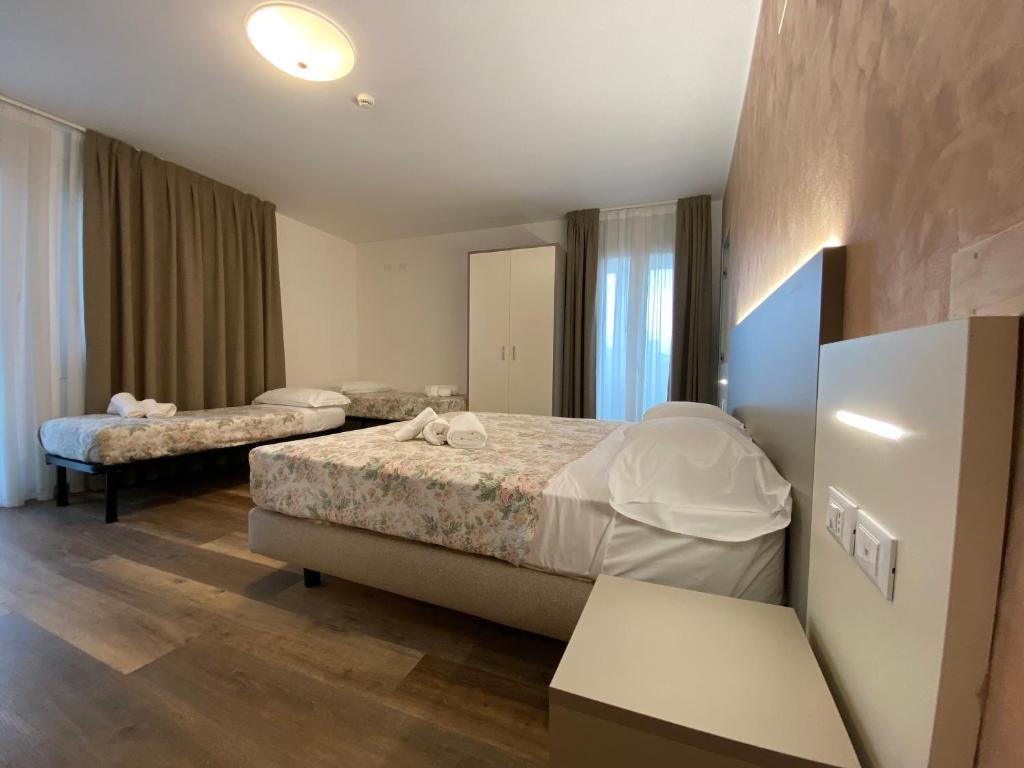 Postel nebo postele na pokoji v ubytování Hotel Lanterna Padova