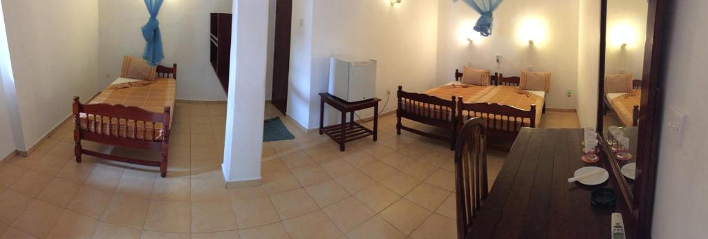 Postel nebo postele na pokoji v ubytování New Imperial Hotel