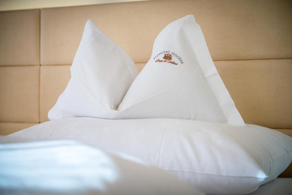 Postel nebo postele na pokoji v ubytování Alphotel Stocker Alpine Wellnesshotel