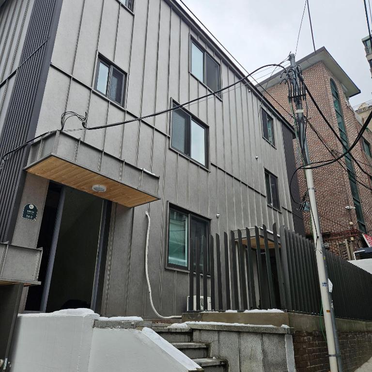 a house with a fence on the side of it at Namsan Rooftop in Seoul