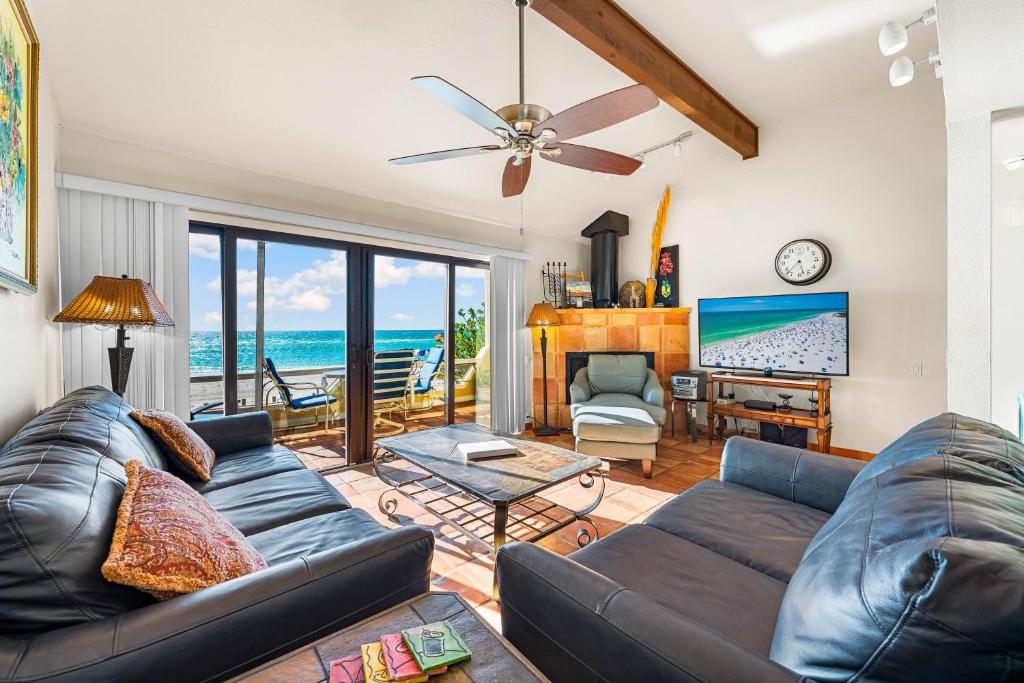a living room with a couch and a table at Fanta-Sea 47 By Beachside Management in Siesta Key