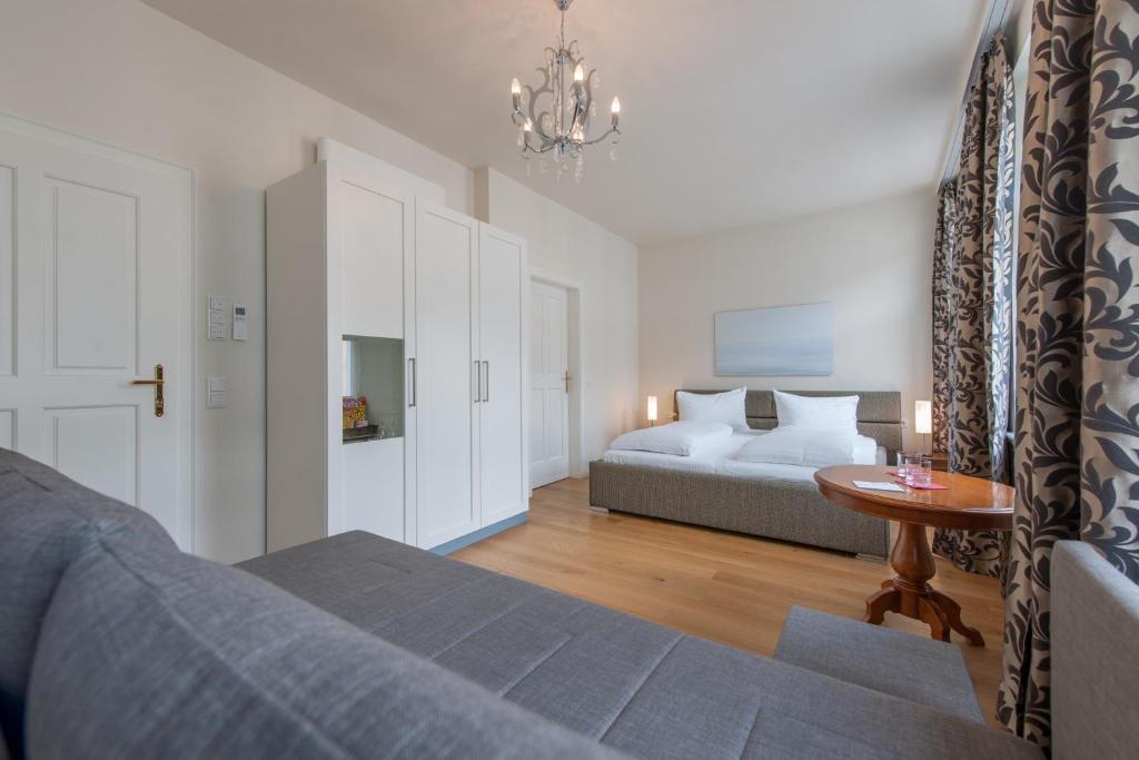 Postel nebo postele na pokoji v ubytování Altstadthotel Wolf-Dietrich