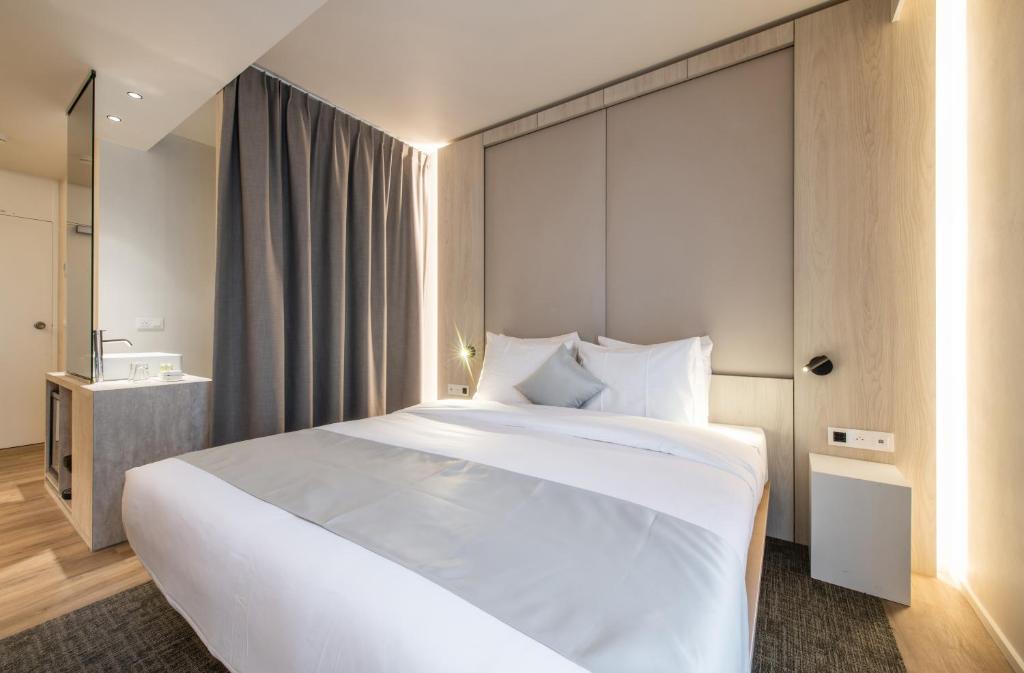 Postel nebo postele na pokoji v ubytování Begijnhof Hotel