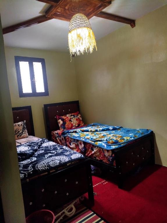 Postel nebo postele na pokoji v ubytování Gîte Assonfo Tachdirt