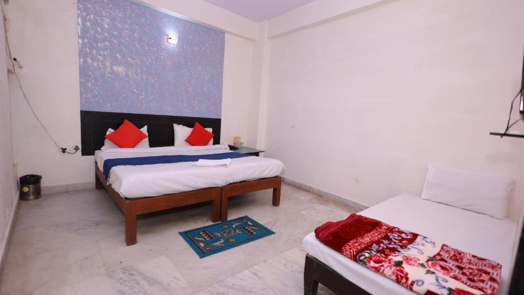 Postel nebo postele na pokoji v ubytování Hotel NoVo Agra - Near Taj Mahal