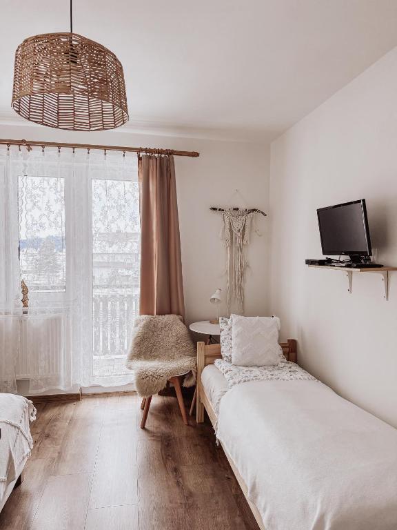 Posteľ alebo postele v izbe v ubytovaní Koralik - BOHO Apartamenty z BALIĄ w CENIE! Kluszkowce - 1 km od Velo Czorsztyn i CzorsztynSKI