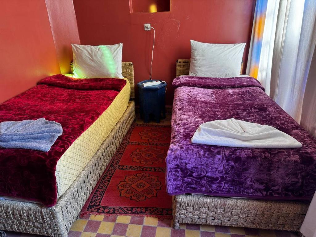Postel nebo postele na pokoji v ubytování Riad Lwalidin