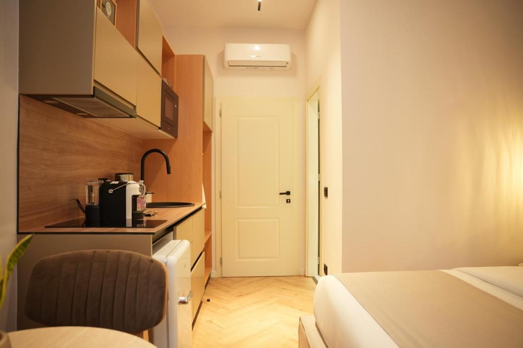 Postel nebo postele na pokoji v ubytování NEA Deluxe Apart-Hotel