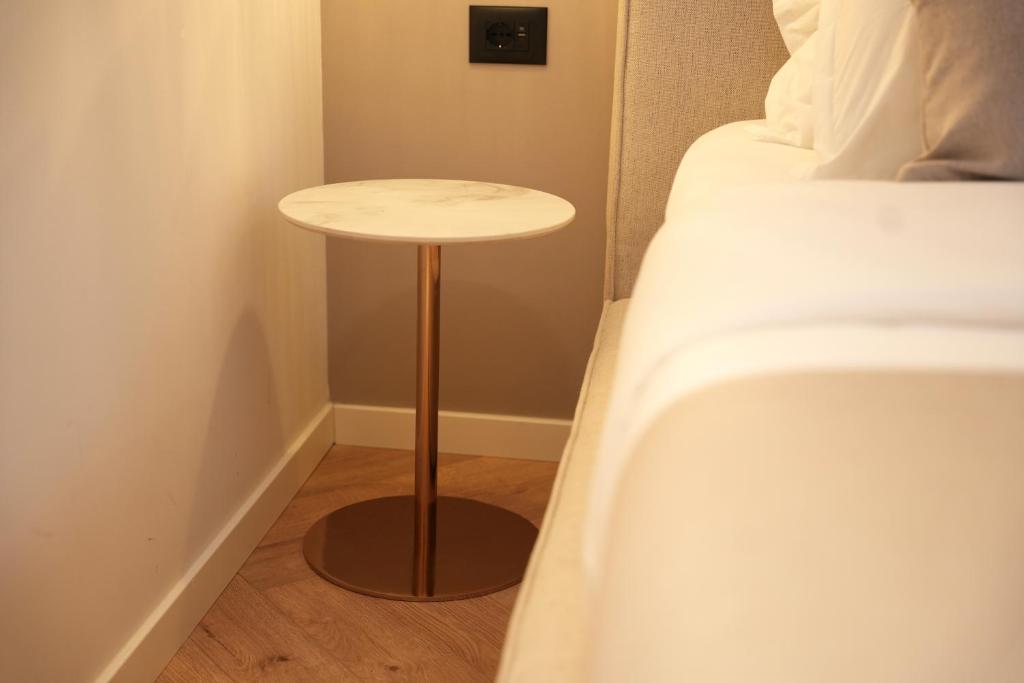 Postel nebo postele na pokoji v ubytování NEA Deluxe Apart-Hotel