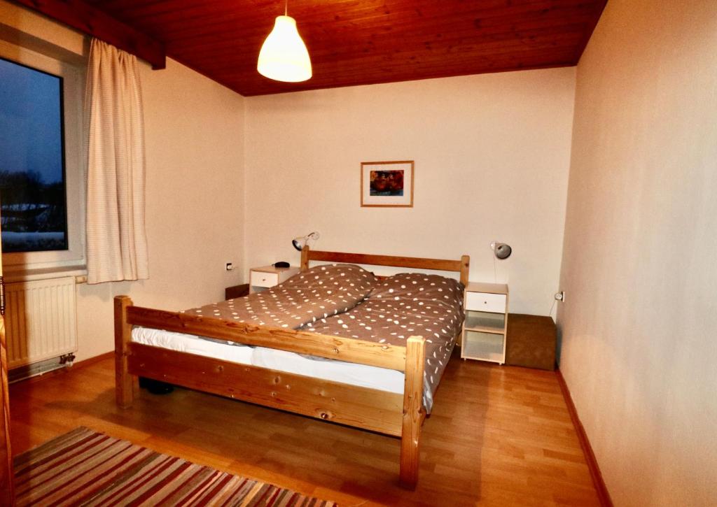 Postel nebo postele na pokoji v ubytování Vakantiehuis Reuzengebergte