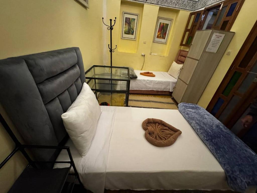 Postel nebo postele na pokoji v ubytování Riad Lwalidin