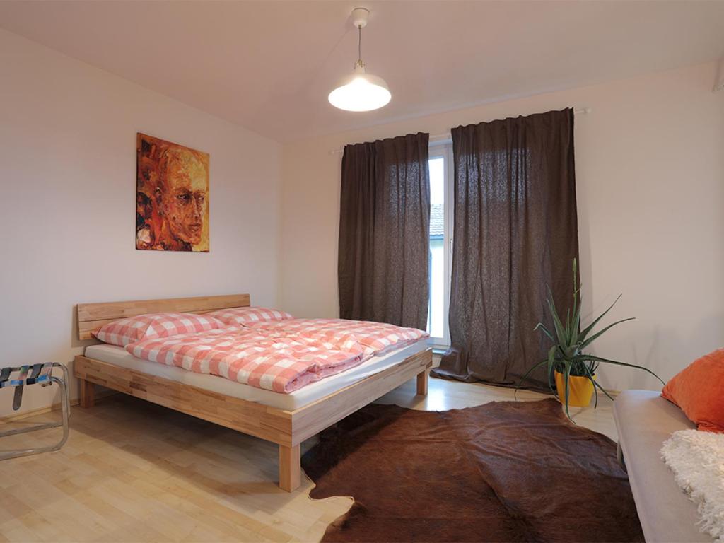 Postel nebo postele na pokoji v ubytování Appartement Györi.