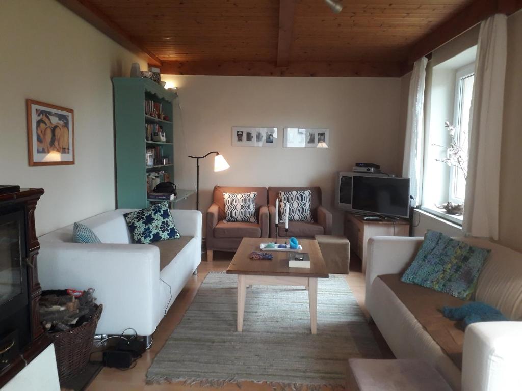 Posezení v ubytování Vakantiehuis Reuzengebergte