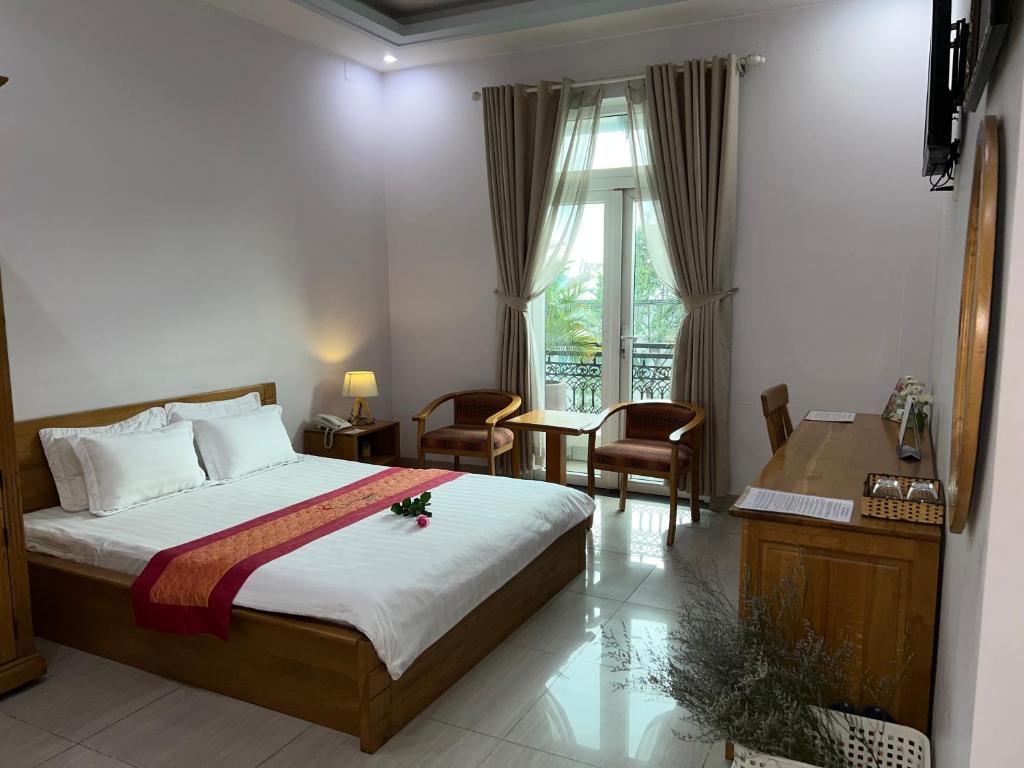 En eller flere senge i et værelse på The Sun Hotel