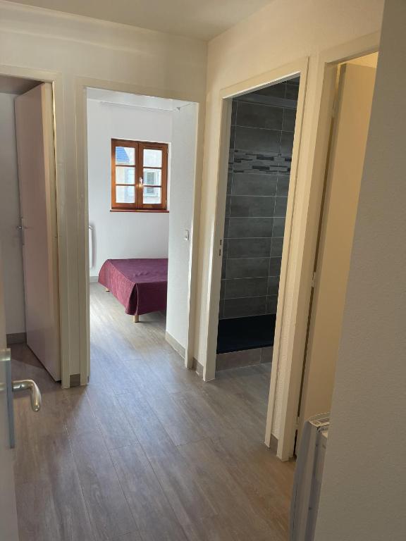 Postel nebo postele na pokoji v ubytování Location Logement T3 à Vignec dans les Pyrénées
