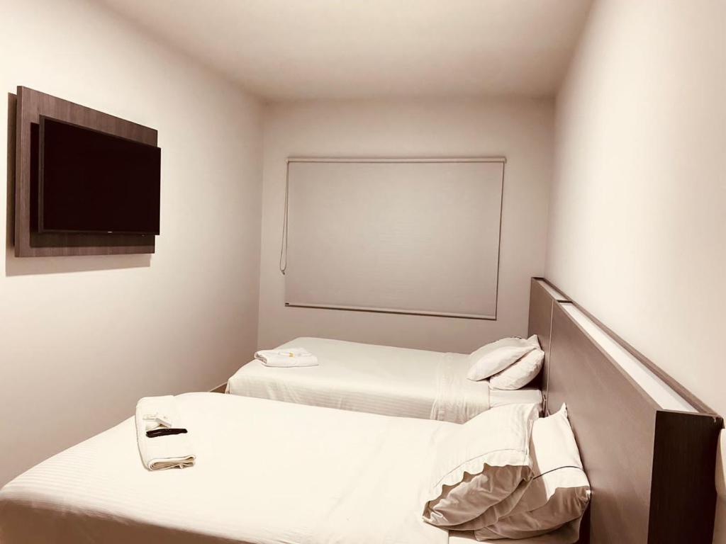 Postel nebo postele na pokoji v ubytování Hotel Doral Inn