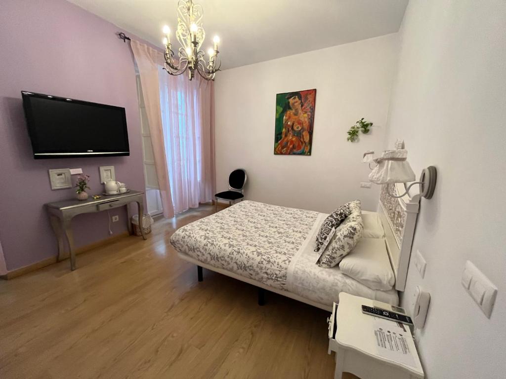 Televízia a/alebo spoločenská miestnosť v ubytovaní Un Patio al Sur