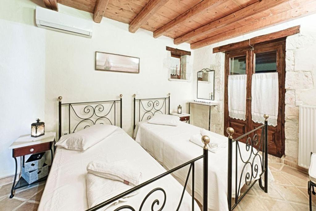Posteľ alebo postele v izbe v ubytovaní Villa Poseidon Residence