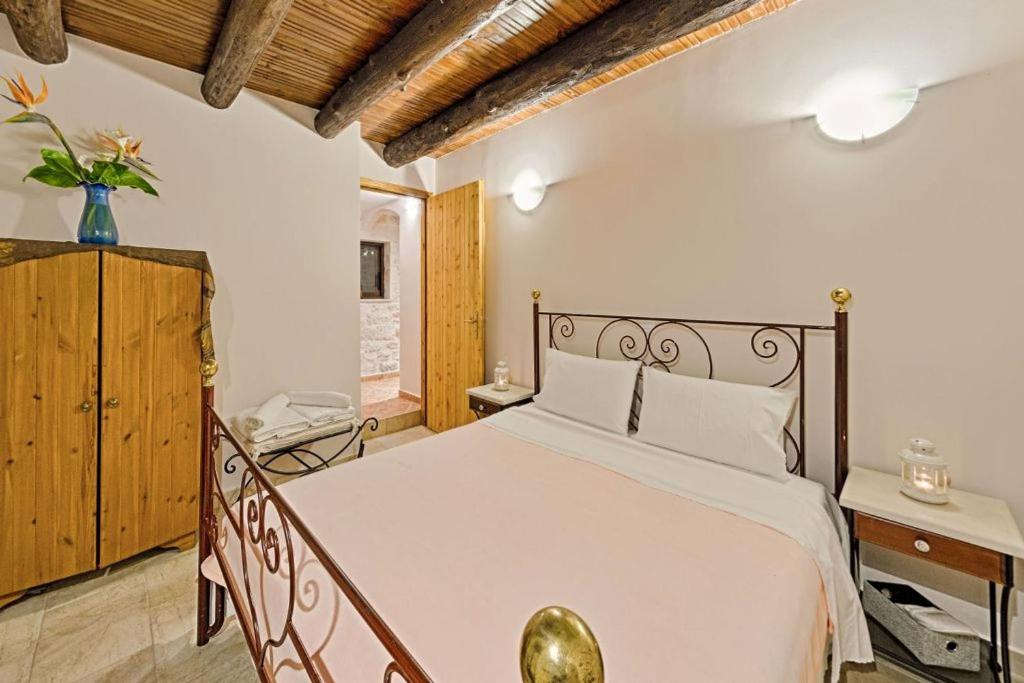 Posteľ alebo postele v izbe v ubytovaní Villa Poseidon Residence