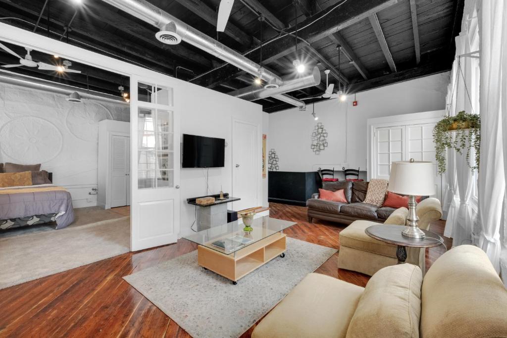 a living room with a couch and a table at Historic Germantown 1br Loft in Philadelphia