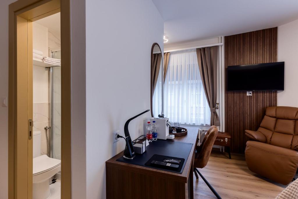 TV a/nebo společenská místnost v ubytování Deluxe Appart & Hotel Zürich Kreis 4