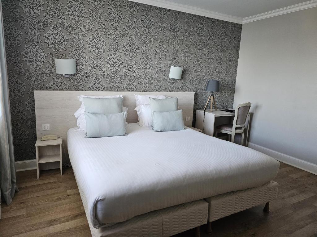 Postel nebo postele na pokoji v ubytování La Côte Bleue