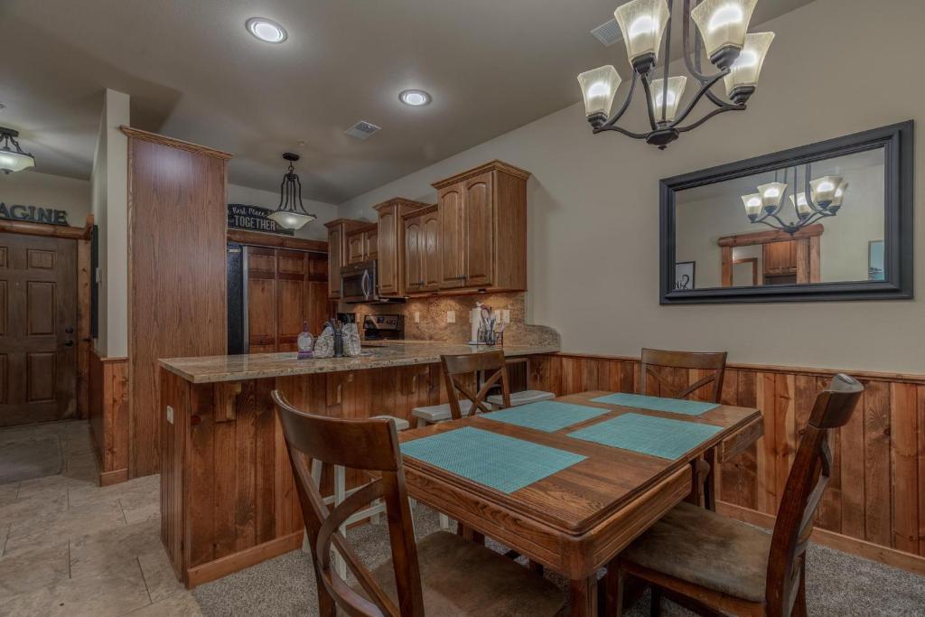 a kitchen with a table and a dining room at 2BR Village At Indian Point 503 near SDC-Free Tickets Daily up to $500 in Branson