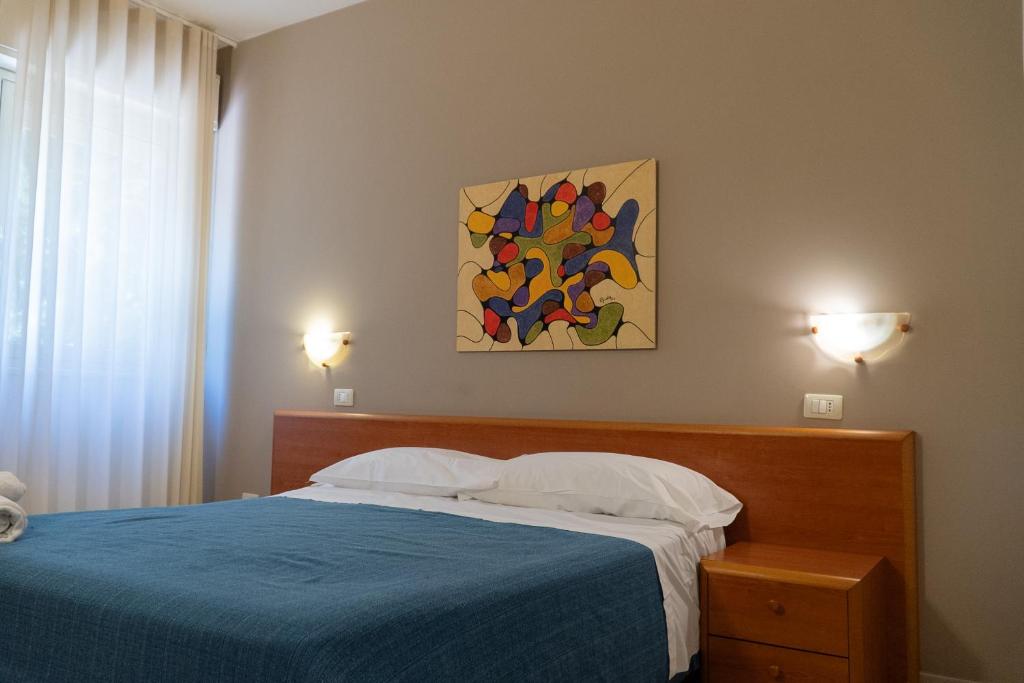 Łóżko lub łóżka w pokoju w obiekcie Hotel Belvedere
