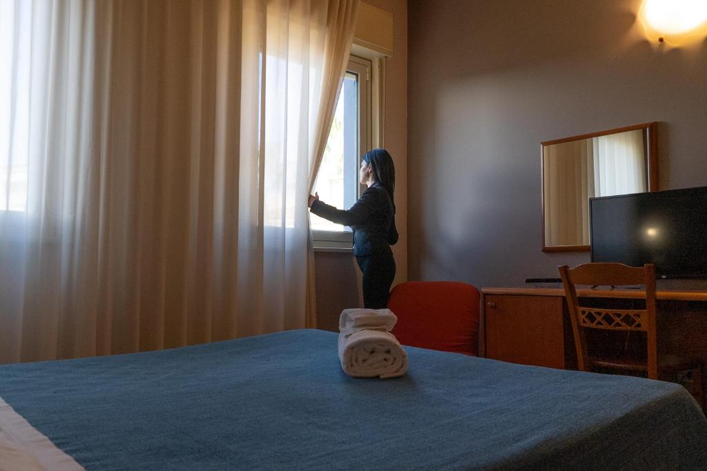 Łóżko lub łóżka w pokoju w obiekcie Hotel Belvedere