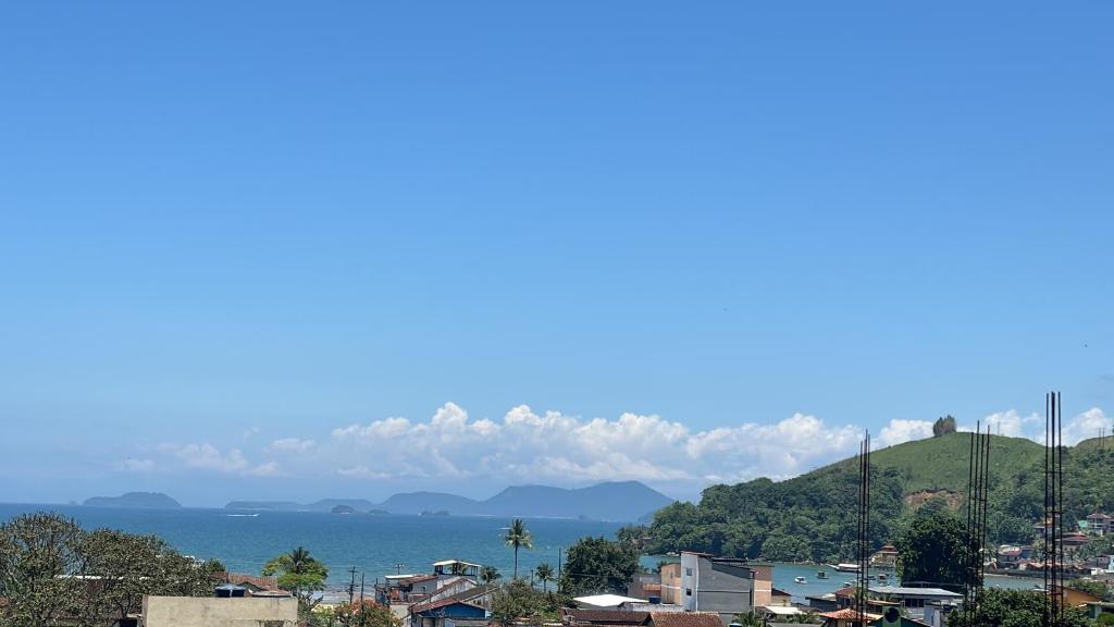 a city with a view of the water and mountains at Casa Lory in Angra dos Reis