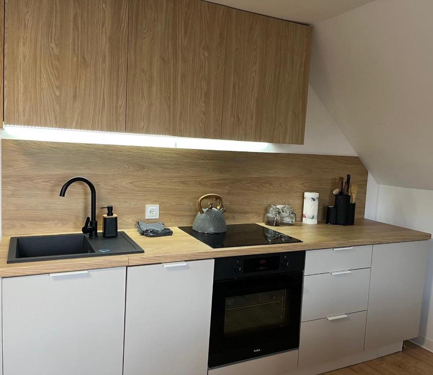 Kuchyňa alebo kuchynka v ubytovaní Apartament Gościnny Zakątek