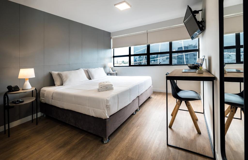 Postel nebo postele na pokoji v ubytování Miraflores Suites Centro