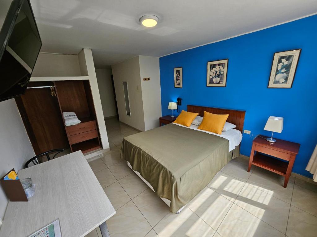 Postel nebo postele na pokoji v ubytování Hotel Acuario