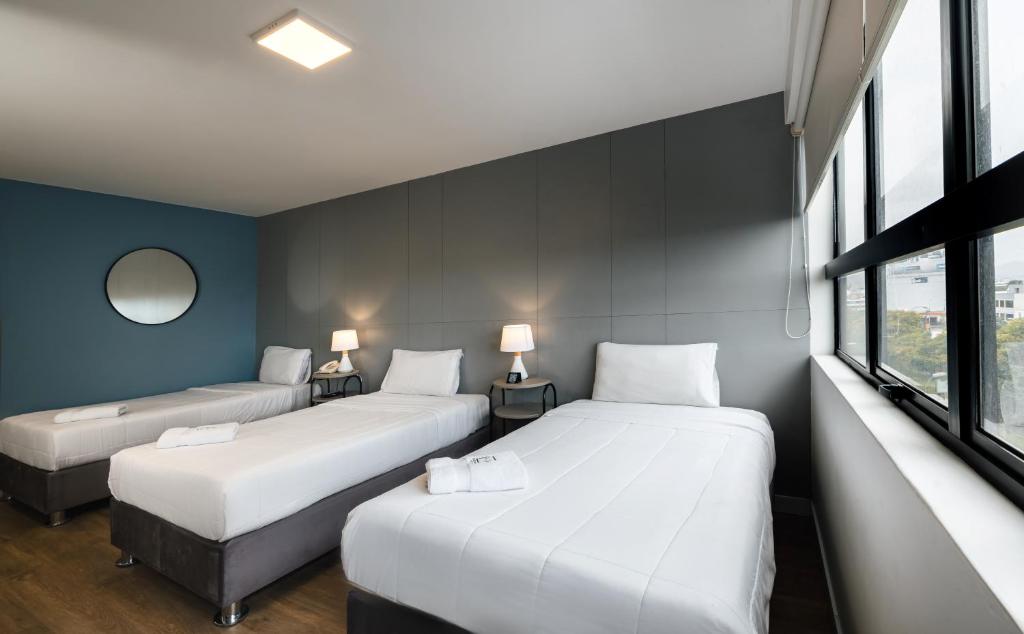 Postel nebo postele na pokoji v ubytování Miraflores Suites Centro
