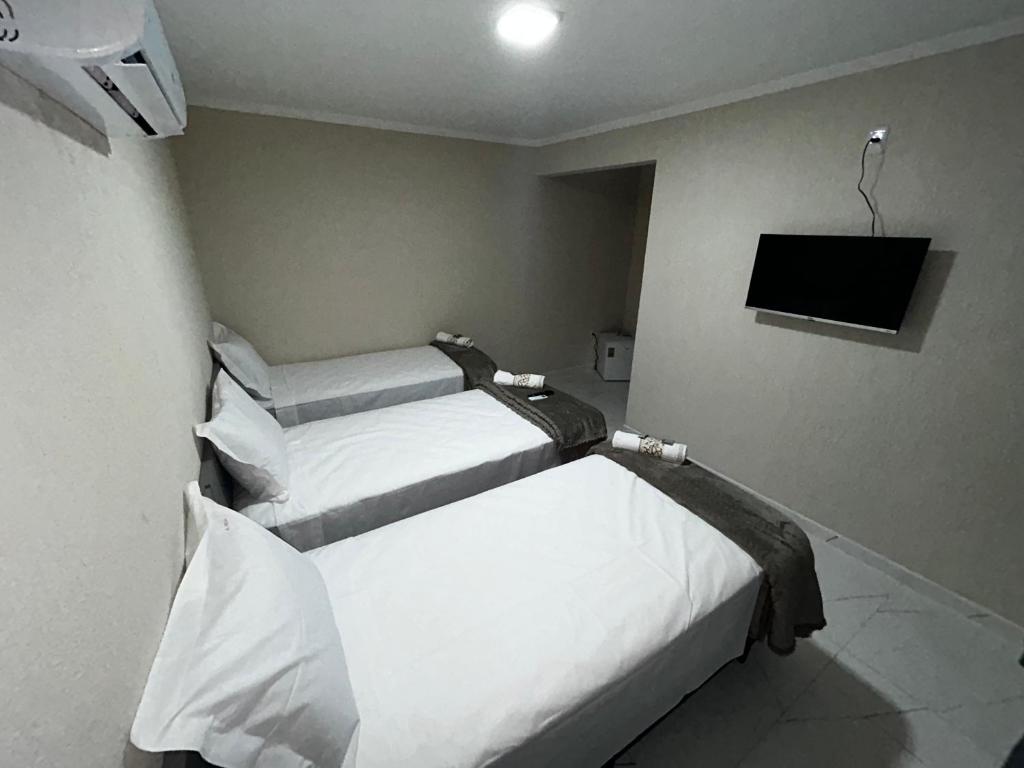 Postel nebo postele na pokoji v ubytování Hotel Aris