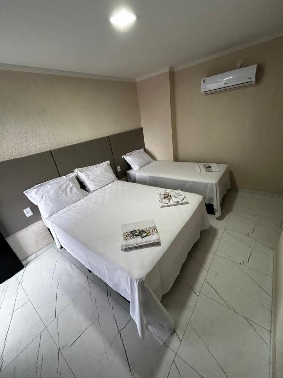Postel nebo postele na pokoji v ubytování Hotel Aris