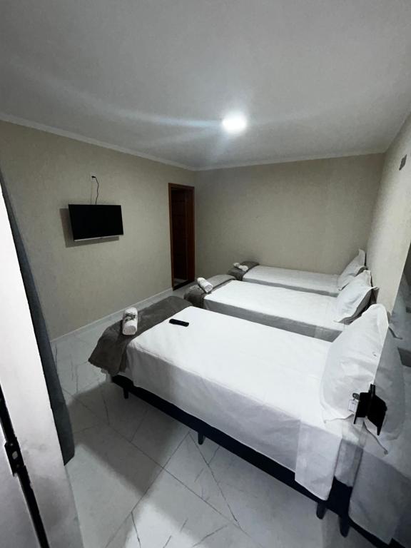 Postel nebo postele na pokoji v ubytování Hotel Aris