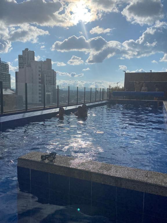 a swimming pool on the roof of a building at Hermoso Apartamento Loft en Bogota Chapinero in Bogotá