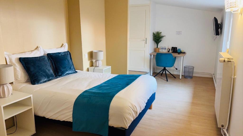 Postel nebo postele na pokoji v ubytování Hôtel Comme chez soi