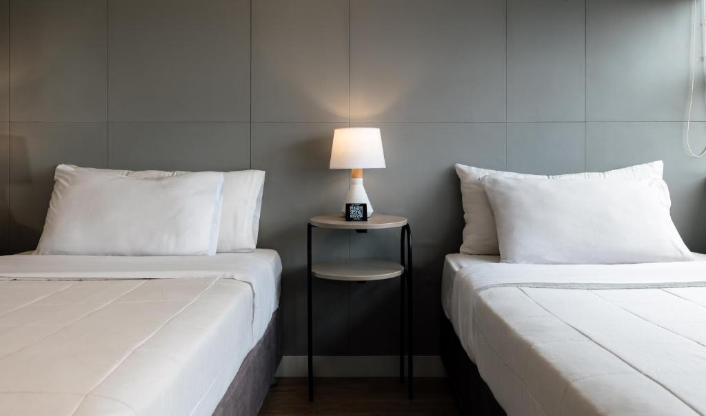 Postel nebo postele na pokoji v ubytování Miraflores Suites Centro
