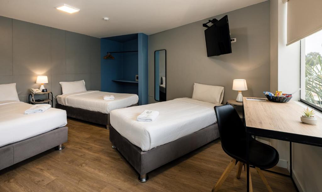 Postel nebo postele na pokoji v ubytování Miraflores Suites Centro