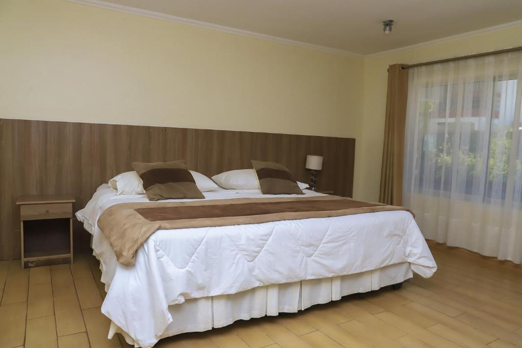 Postel nebo postele na pokoji v ubytování Vitrali Suite